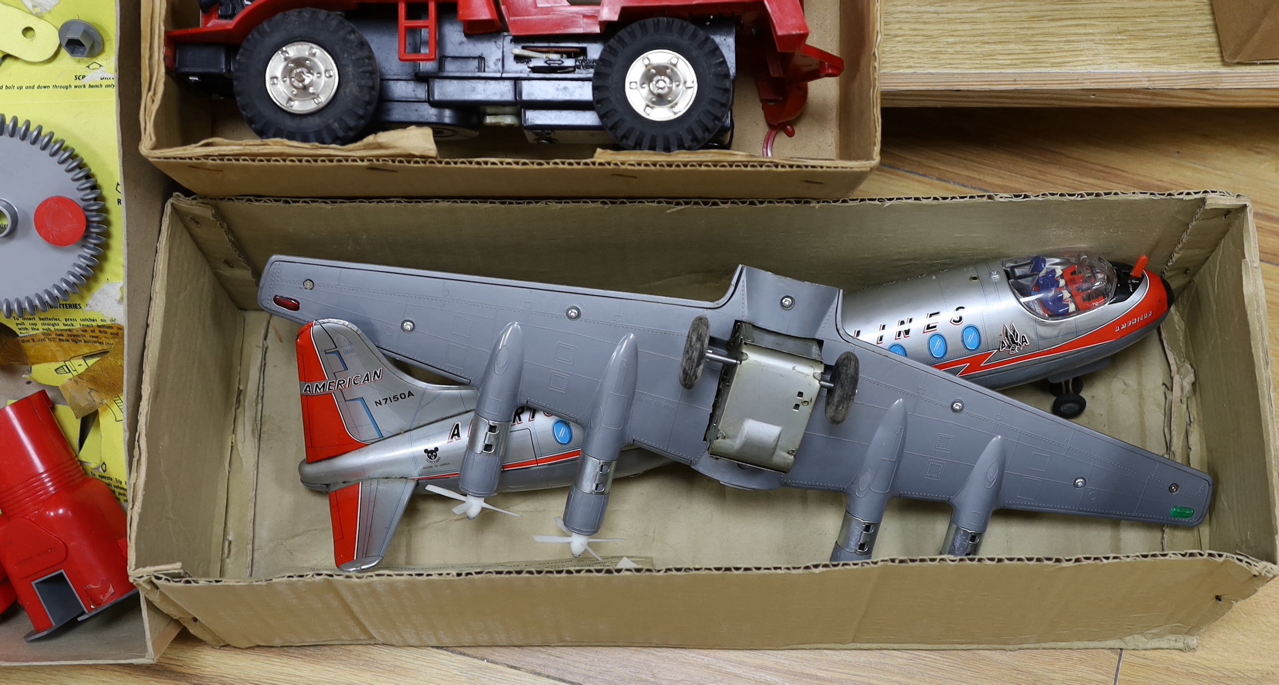 Three boxed 1960s battery operated plastic toys including a Rosho Toy tinplate and plastic airliner, a Marx Power-Brute Cement Mixer and a Chad Valley Play Drill, air liner 45cm long